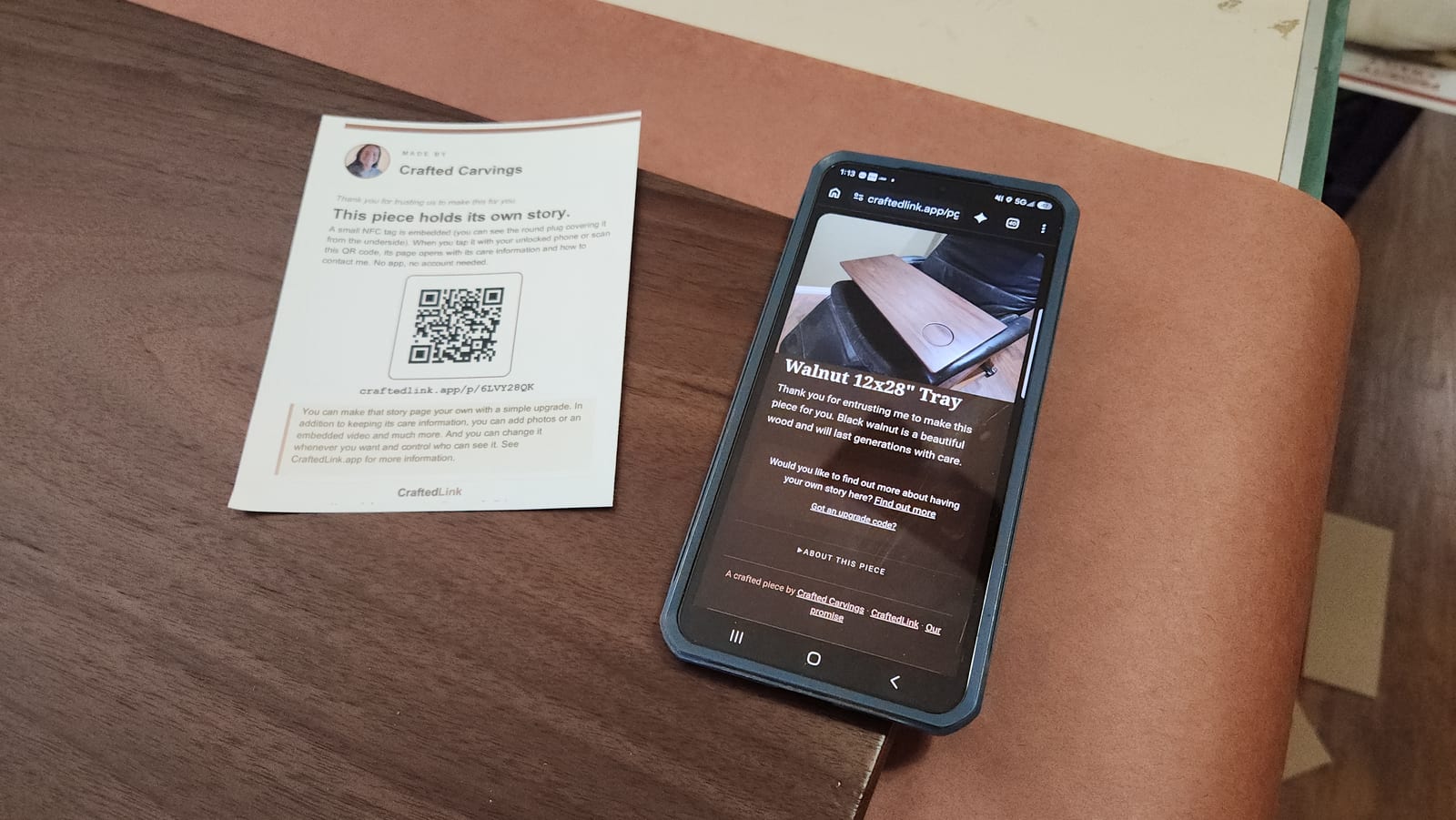 A walnut tray, the insert card that ships in its box, and the page a tap opens